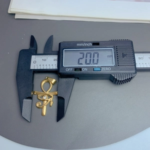 Detailed measurement of gold Ankh and Eye of Horus pendant showing height of 20.0mm