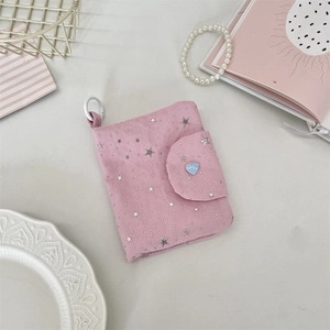 Pink canvas card holder with silver stars, blue heart detail, and white plastic ring hook