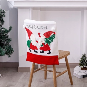 Christmas chair cover with Santa embroidery and white plush ball on wooden dining chair