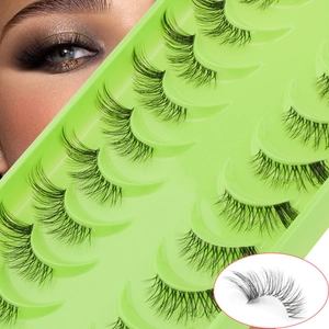 Detail view of half eyelashes in a green tray with model application and macro zoom