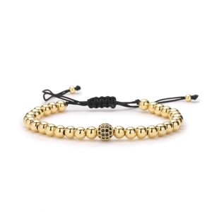 Bracelet tissé ajustable avec billes dorées et breloque boule en zircon noir serti