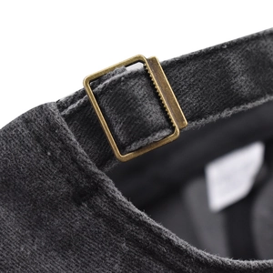 Detail of adjustable metal buckle on washed cotton baseball cap in charcoal grey finish