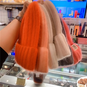 Detail of five colorful mohair beanies featuring California 1982 embroidered labels