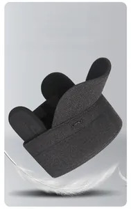 Close-up of dark grey wool winter cap with ear flaps and premium SPORT metal badge detail