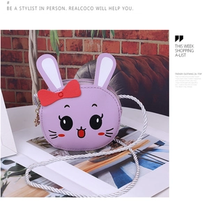 Detail of purple bunny child bag featuring a red bow and cute star-shaped zipper head