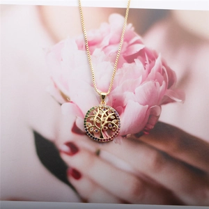 Detailed close-up of golden Tree of Life necklace featuring colorful cubic zirconia stones