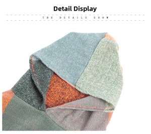Close-up of knit poncho texture featuring color-block patterns and detailed hood design