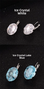 Macro view of white and lake blue ice-cut oval zircon leverback earrings on black board