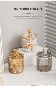 Detailed view of striped acrylic storage jars with decorative bear handles in three colors