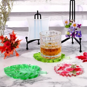 DIY silicone molds for resin coasters featuring maple leaf and monstera leaf shapes