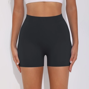 Detailed view of high-waist black yoga shorts with peach lift and ruched compression