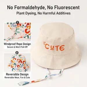 Kids reversible cotton bucket hat with 'CUTE' embroidery and adjustable windproof rope