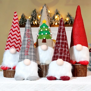 Close-up of five unique Christmas gnome plush dolls with festive patterns on wood