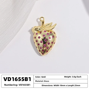 Macro shot of 18x25mm gold-plated brass strawberry pendant with purple gemstones