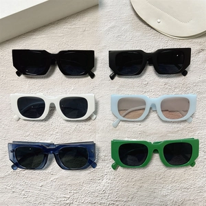 Detailed grid of vintage square sunglasses in six assorted colors on stone surface