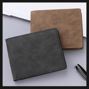 Detail view of vintage leather wallets showing precise stitching and smooth textures