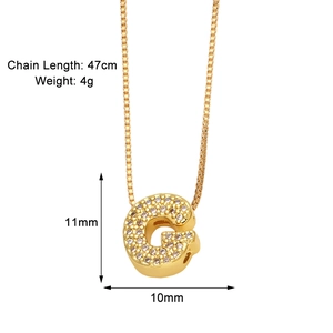 Detailed view of golden letter G pendant set with zircon stones including size specifications
