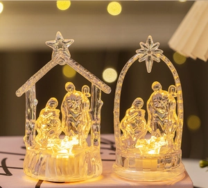Detail view of transparent LED Nativity scene with warm light and bokeh background
