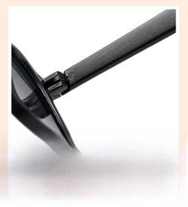 Detailed close-up of sturdy metal hinge on black vintage kids square sunglasses