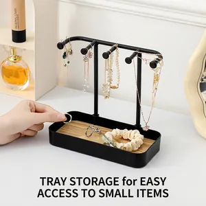 Black metal jewelry organizer with wooden tray for necklaces earrings and rings