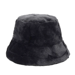 Close-up of the plush black faux fur bucket hat showing its thick warm texture