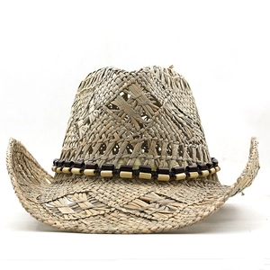 Handwoven Western cowboy straw hat in light brown with decorative beaded band