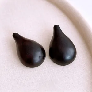 Elegant water drop resin wooden earrings with natural grain texture in a display tray