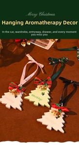 Close-up of Christmas tree plaster scent ornaments with ribbons and golden bells