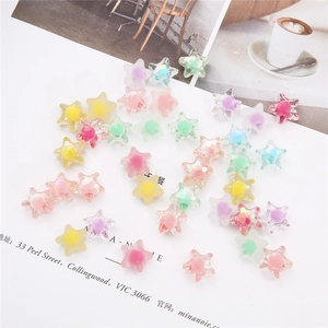 Detailed macro view of colorful faceted acrylic star beads for DIY jewelry making
