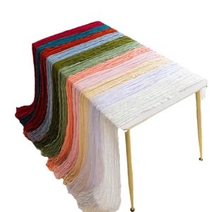Folded gauze cheesecloth table runners in multiple colors with crinkle texture