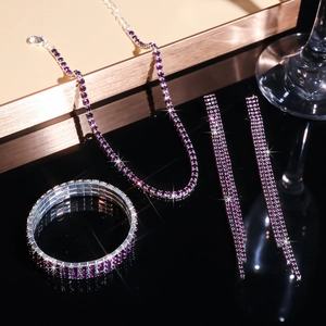 Detailed macro shot of silver bridal jewelry set with sparkling purple rhinestones