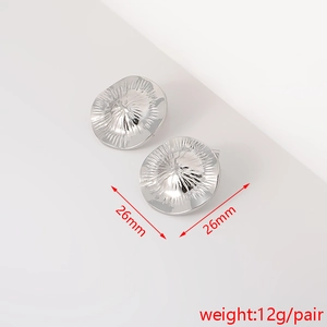 Detailed view of silver flower textured earrings with 26mm size and 12g weight specs