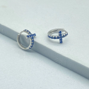 Detailed macro of S925 sterling silver stamp on cross earring with blue stone