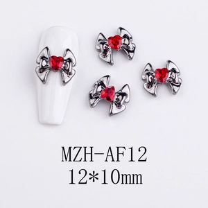 Macro view of vintage heart alloy nail art charms with red gemstones, size 12x10mm