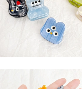 Detailed view of mini acetate cartoon monster hair claws in various vibrant candy colors