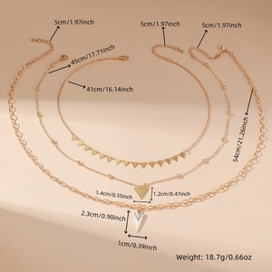 Detailed view of layered gold necklace set with engraved dimensions and weights