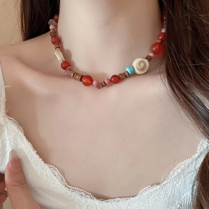 Vintage stainless steel beaded necklace with red agate, wood beads and shell pendant