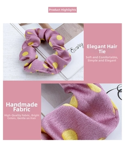 Detail of purple satin scrunchie with yellow polka dots on a stylish background