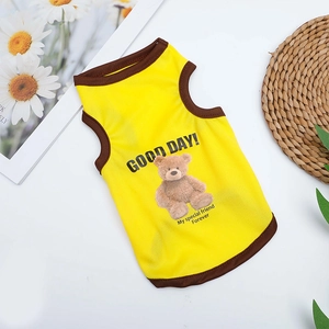 Detail of yellow breathable mesh pet vest with bear print and brown piping for summer