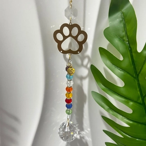 Rainbow crystal suncatcher with golden dog paw charm and faceted ball for garden