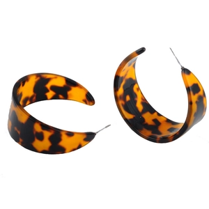 Chic acetate C-shaped earrings with amber leopard print pattern on white background