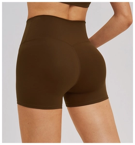 Detail of high-waist yoga shorts with crossover waistband and butt-lifting seam design