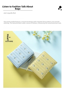 Detail of light blue and yellow quilted wallets with delicate white floral embroidery