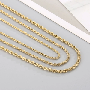 Three multi-length 18K gold-plated twisted rope chain necklaces in a minimalist layout