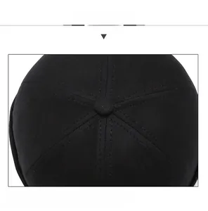 Detail view of the black cotton twill docker cap showing six-panel stitching and top button
