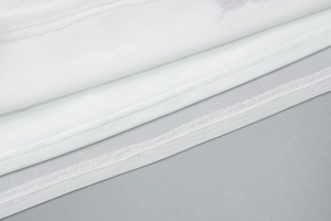 Detail of white mesh stitching and precise double-layer hemline on the fashion skirt set
