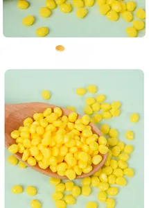 Macro shot of realistic yellow corn kernels DIY accessories in a wooden spoon