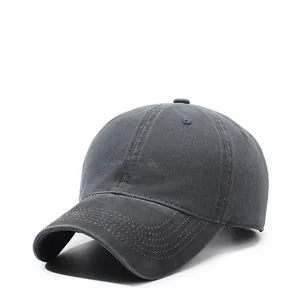 Detail of embroidered COVENRAT logo on dark gray washed cotton baseball cap