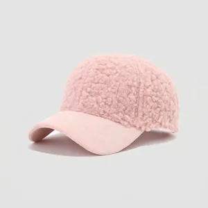 Detailed texture of pink lamb wool fleece baseball cap with soft suede brim for children