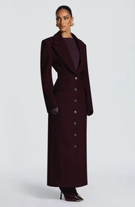 Detail of slim fit dark purple wool coat with classic wide lapels and button closure